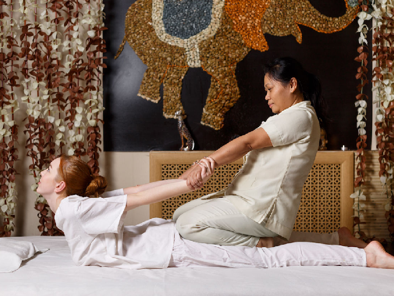 Traditional Thai massage stretching therapy